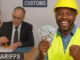 Construction worker holding a Tariff check