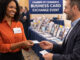 Factoring broker exchanging her business card with a business owner at a Chamber of Commerce event.